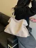 Bolsa tejida de gran capacidad para mujer, nuevo modelo 2026, bolso de hombro de nicho de alta gama, bolsa de mano casual de moda