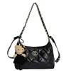 Bolso hobo cadena estilo 2026 inspirado en Chanel con patrón de diamantes, bolso de hombro de cuero encerado retro, bolso tote versátil
