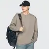 Camiseta de manga larga texturizada estilo retro americano para hombre, nueva primavera/otoño 2026, corte holgado, adecuada para ir al trabajo, con cuello henley