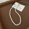 Collar de perlas de azúcar con temperamento retro francés, cadena para suéter de moda Joker de alto sentido, joyería simple de nicho al por mayor