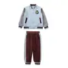 Uniforme escolar de primaria traje de primavera y otoño uniforme de jardín de infancia estilo académico uniforme de clase de deportes conjunto de cuatro piezas para niños de primer grado