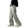 Pantalones de estilo retro americano para hombre, adecuados para primavera y otoño, con un diseño de moda de alta costura, un aspecto lavado y desgastado, y un acabado de mezclilla teñido en barro amarillo.