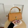 Bolso de moda con cierre de hebilla tejida y tacto de calidad, nuevo modelo 2026, adecuado para ir al trabajo, bandolera, de mano, al hombro, bolso cuadrado pequeño