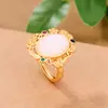 Celebridad en línea Suministro en vivo al por mayor Diseño de nicho Sentido del diseño Oro antiguo incrustado Jade Hetian Flor abierta Anillo Joyería femenina