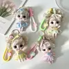 Exquisita figura de muñeca llavero con diseño de vestido a cuadros, un pequeño regalo creativo para mochilas, disponible para venta al por mayor