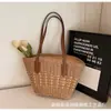 Bolso tejido de paja para mujer, vacaciones de verano en la playa junto al mar 2026 nuevo bolso de mano retro francés de celebridad de internet