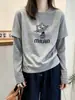 Camiseta Manga Longa Patchwork Listrada Falsa Duas Peças Feminina Outono 2026 Solta Modeladora Senso de Design Camiseta Básica Cartoon