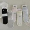 26 Calcetines Nuevos de Primavera Estilo Coreano Borde Enrollado Abotonados Calcetines de Media Pantorrilla para Mujer Versátiles Estilo Miu Puño Suelto Calcetines Arrugados Sin Costuras