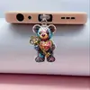 Tapón de polvo para teléfono móvil 2D, colgante acrílico de gatito transfronterizo, colgante de Tipo C enojado, artículo de venta caliente, otros productos africanos