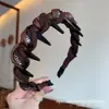 2026 Coreano Dongdaemun Estilo Nuevo Color Café Estampado de Leopardo Diadema Retorcida con Dientes Elegante Versátil Accesorio para el Cabello