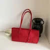 2026 Nova Bolsa de Ombro/Axila Feminina Retro Simples Textura Camurça Pingente de Estrela Formato Baguete Multicor