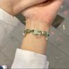Novo estilo chinês impressão coração a coração Marca Fu Pulseira trançada de sino simples elegante imitação de Jade corda de mão de casal para puxar all-match