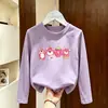 Camiseta de manga comprida para meninas 2026 primavera e outono estilo infantil algodão puro base para crianças mais velhas com design de desenho animado top da moda