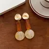 Pendientes de botón con colgante redondo de resina de aguja plateada, pendientes simples de moda de nicho de alta gama, joyería para orejas de personalidad de lujo ligero, temperamento para mujer