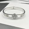 Pulsera europea y americana simple de acero de titanio chapado en oro de 18 quilates con micro incrustaciones de circón colorido de diamante completo, pulsera de moda ins para mujer en stock al por mayor
