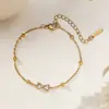 Tornozeleira de Aço Titânio Ouro 18K de Luxo Leve Estilo Novo Primavera e Outono para Mulheres, Corrente de Pé Não Desbota Atacado