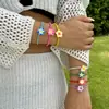 Nuevo Pulsera de Plumeria Estilo Bohemio de Resort Transfronterizo Europeo y Americano Versátil Flor de Arcilla Suave Pulsera de Cuentas de Arroz para Mujer