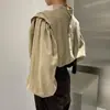 Corea del Sur chic otoño estilo francés cuello alto medio diseño de botón trasero sentido de diseño moda nicho blusa top de manga farol para mujer