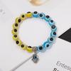 Novo bracelete elástico de pingente de contas de olhos azuis ocos de palma europeu e americano transfronteiriço joias de casal vendas diretas de fábrica