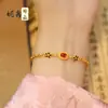 Transmisión en vivo del mismo estilo pulsera de arena dorada vietnamita estilo chino nuevo Fenghua exquisita incrustada con rubí para mujer alta gama estilo palacio