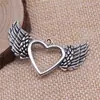 47x 29mm 4.5g comercio exterior AliExpress explosiones calientes colgante de corazón de amor alas de amor huecas