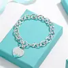 Pulsera para Pareja Etiqueta Inglesa en Forma de Corazón Marca T Cierre de Amor Ot Esmalte Azul Anillo de Corazón Melocotón Joyería Estilo Ins Transfronterizo
