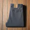Pantalones de algodón sarga gruesos para hombre Otoño e Invierno, amigables con la piel, cómodos, microelásticos, de cintura media, corte recto, grises, pantalones casuales de negocios