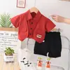 Verano nuevo overol chaleco camisa manga corta pantalones cortos casuales para bebés y niños pequeños dos piezas moda una generación de pelo
