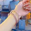 Libro Rojo Pequeño Más Vendido Pulsera Jingle de Concubina Imperial Pulsera Antigua de Verano Hanfu Pulsera de Esmalte Versátil Caja Ciega de Tono Vibrante Mano