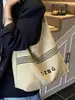 Bolsa Casual Mãe e Filha Transfronteiriça Outono e Inverno Bolsa Simples de Lona 2026 Grande Capacidade High-End Simples Bolsa de Ombro de Axila
