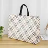 Nuevas bolsas de tela no tejida de moda en stock, personalizables para tiendas de ropa, con un toque de alta gama estilo ins, se pueden personalizar