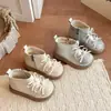 Invierno 2026 Estilo Nuevo Niñas Niños Moda Botas Cortas con Lazo de Pedrería Estilo Coreano Botas de Piel de Princesa Zapatos para Niños Venta al por Mayor