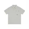 Camisa Polo Casual Nanxia com Botões Decorados no Bolso Manga Curta Masculina de Verão Gola Reversível Simples Ombro Caído Versátil