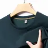 Entrega Direta da Fábrica Camiseta Masculina de Manga Curta Verão 2026, Estilo Fino, Cor Sólida, Gola Redonda, Top Casual para Homens Jovens e de Meia-Idade