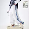 Pantalones de chándal gruesos forrados de forro polar para niño, de pierna recta ancha, con bloques de color, para invierno 2025, nuevos pantalones casuales para niño