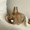 Bolso esponjoso simple de nicho de alto valor para mujer 2026 nuevo bolso de felpa de otoño de un solo hombro con gran capacidad tipo cubo