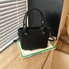 Bolsa Quadrada Pequena Simples Feminina Grande Capacidade Nova Primavera/Outono 2026 Design de Nicho Retrô Bolsa para Trabalho e Deslocamento Bolsa de Ombro Único