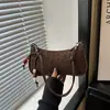 Bolso de mano retro para mujer 2026, bolso de hombro elegante y versátil con acabado texturizado