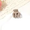 Pinza de calabaza 2026 nuevo modelo para sujetar coletas altas, pinza pequeña simple para la parte trasera de la cabeza, accesorio para el cabello tipo pinza de cangrejo para mujer