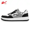 Zapatos casuales planos transpirables versátiles para hombre otoño primavera y otoño estudiantes de secundaria superficie de cuero deportivo Zapatos de moda blancos impermeables