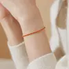 Pulseira Minimalista Exquisita de Corda Vermelha com Diamante Único e Trama Dupla em Aço Titânio para Mulheres Moda Versátil Tendência Acessório de Nicho