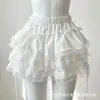 Sin error, este es un conjunto de lencería sexy que presenta un body, una falda abullonada y un atuendo de encaje, perfecto para Halloween.
