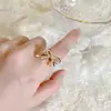 Anel de Dedo Feminino Exquisito de Pérolas de Arroz de Luxo Leve Nicho Anel Aberto Popular na Internet Tendência 2022 Novo Anel Vazado de Laço