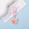 Chaveiro Pingente Urso de Resina Fofo com Laço de Bolinhas Coloridas Decoração de Sacola de Presente Cultural e Criativa DIY