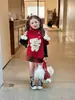 Nueva colección de otoño e invierno para niñas estilo coreano Ningli: lindo chaleco capa asimétrico rojo con tema de perro y falda de cuadros rojos