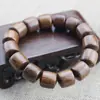 Venta al por mayor de fábrica pulsera de sándalo de seda dorada cuentas de barril de personalidad 15 mm cuentas de Buda de madera joyería para hombres y mujeres transmisión en vivo bienestar