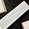 Aurora Symphony Luz Amplia Ojo de Gato Uñas Postizas Pre-Hechas Tiras 30 Piezas Tamaños Variados Uñas Portátiles Personalizadas de Fábrica