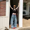 Pantalones de Mezclilla de Pierna Ancha de Cintura Baja Retro Americano Desgastado Versátiles Sueltos Adelgazantes con Corte Curvo para Mujer, Nueva Tendencia Verano 2026