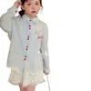 Ropa popular coreana Bokabo para niñas: conjunto de tres piezas para niños con protección solar (camisa + falda), primavera/verano/otoño 2026
