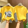 Camiseta de manga larga a rayas de algodón puro para niñas, colección primavera/otoño 2026, estilo nuevo, diseño de caricatura lindo, capa base versátil y a la moda